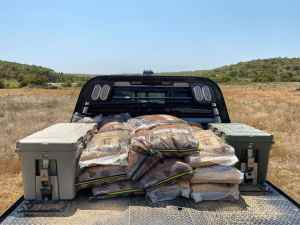Apex coolers are secured to the metal flat bed OKC